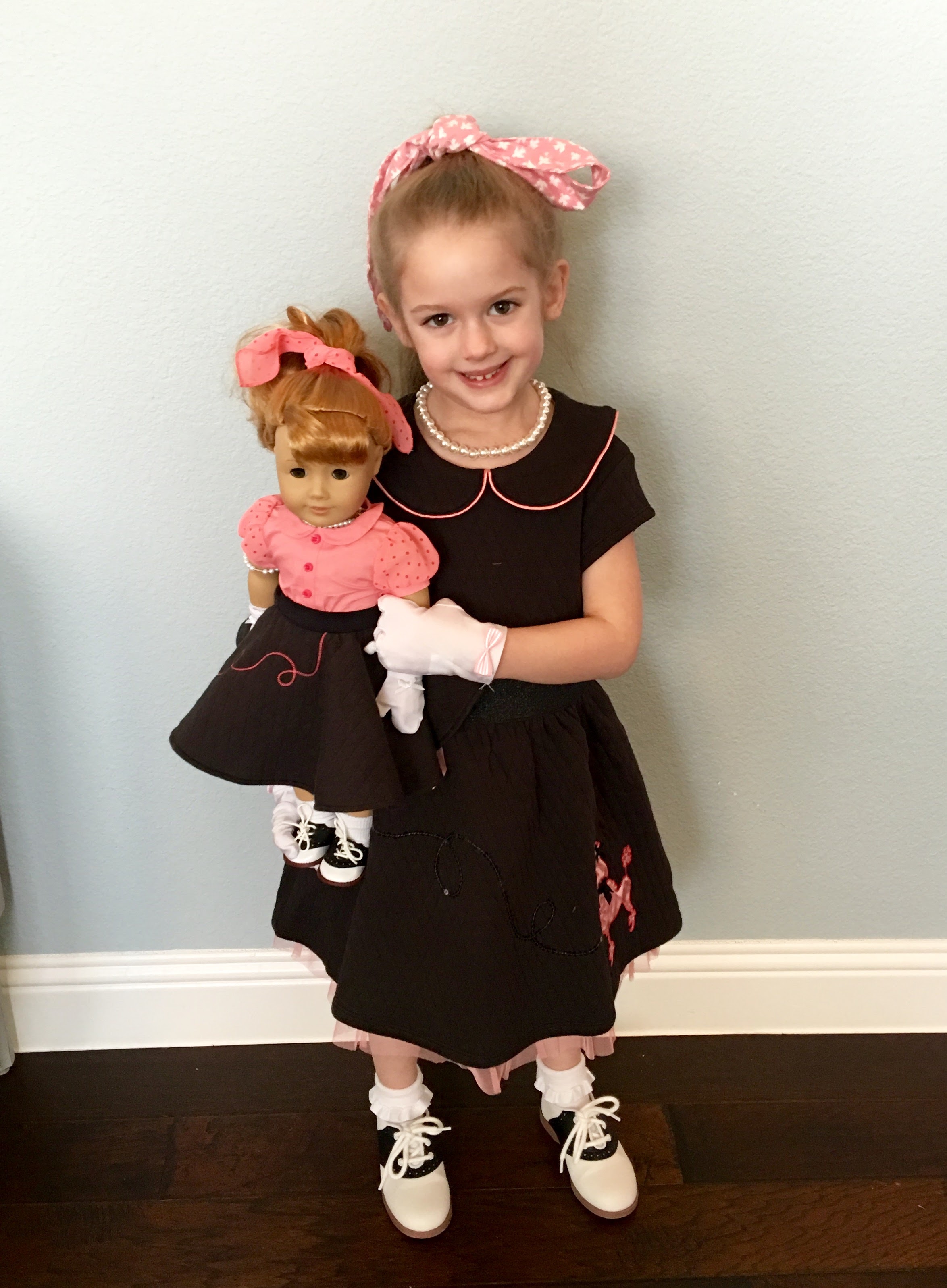 Holiday with her 1950's era Maryellen BeForever American Girl Doll along with a coordinating girl outfit also from American Girl 