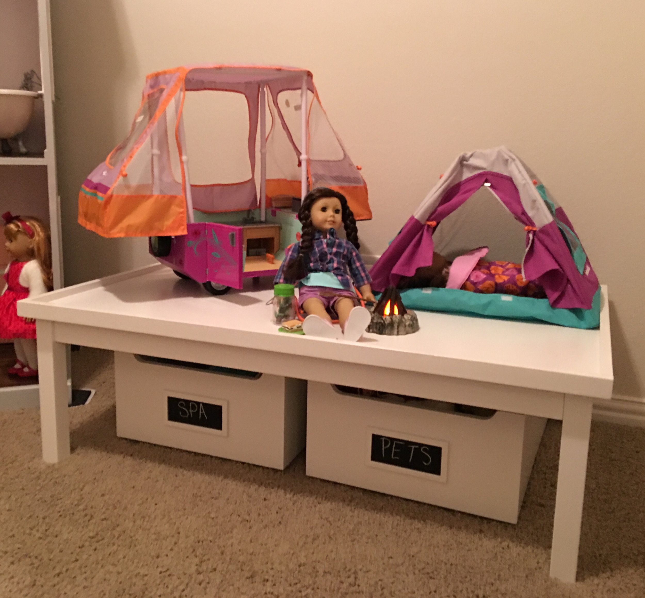 Y'all know I'm OBSESSED with the Carolina Activity Table and Carts from Pottery Barn Kids. It's SO super useful for doll play so whatever Holiday is really focused on can be elevated and set apart to a great play height. In the left cart is all of her American Girl Spa accessories while the right bin houses all of her AG pets and their accessories. 