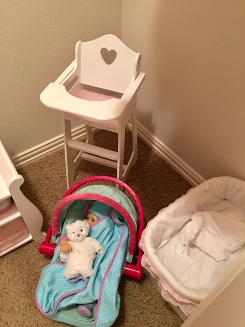 On the right side we have Bitty's Travel Seat another heirloom wooden cradle I've had for years and a wooden doll high chair. 