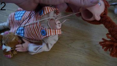 Put hook through the loop on the neck