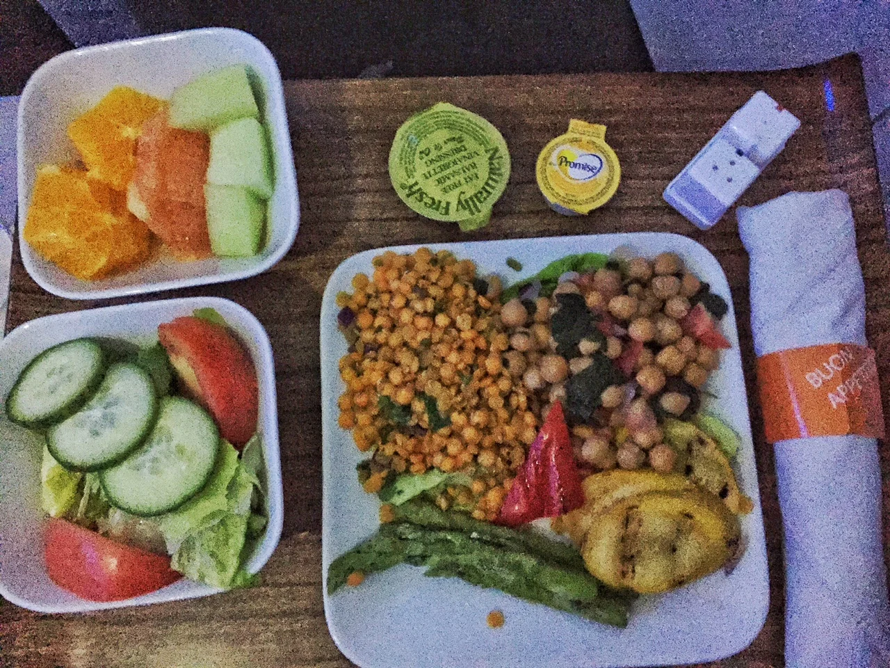 Mini salad with cucumbers and tomatoes sliced oranges, honeydew and grapefruit Vegetable platter with chickpea salad, curried lentils, roasted yellow squash and asparagus