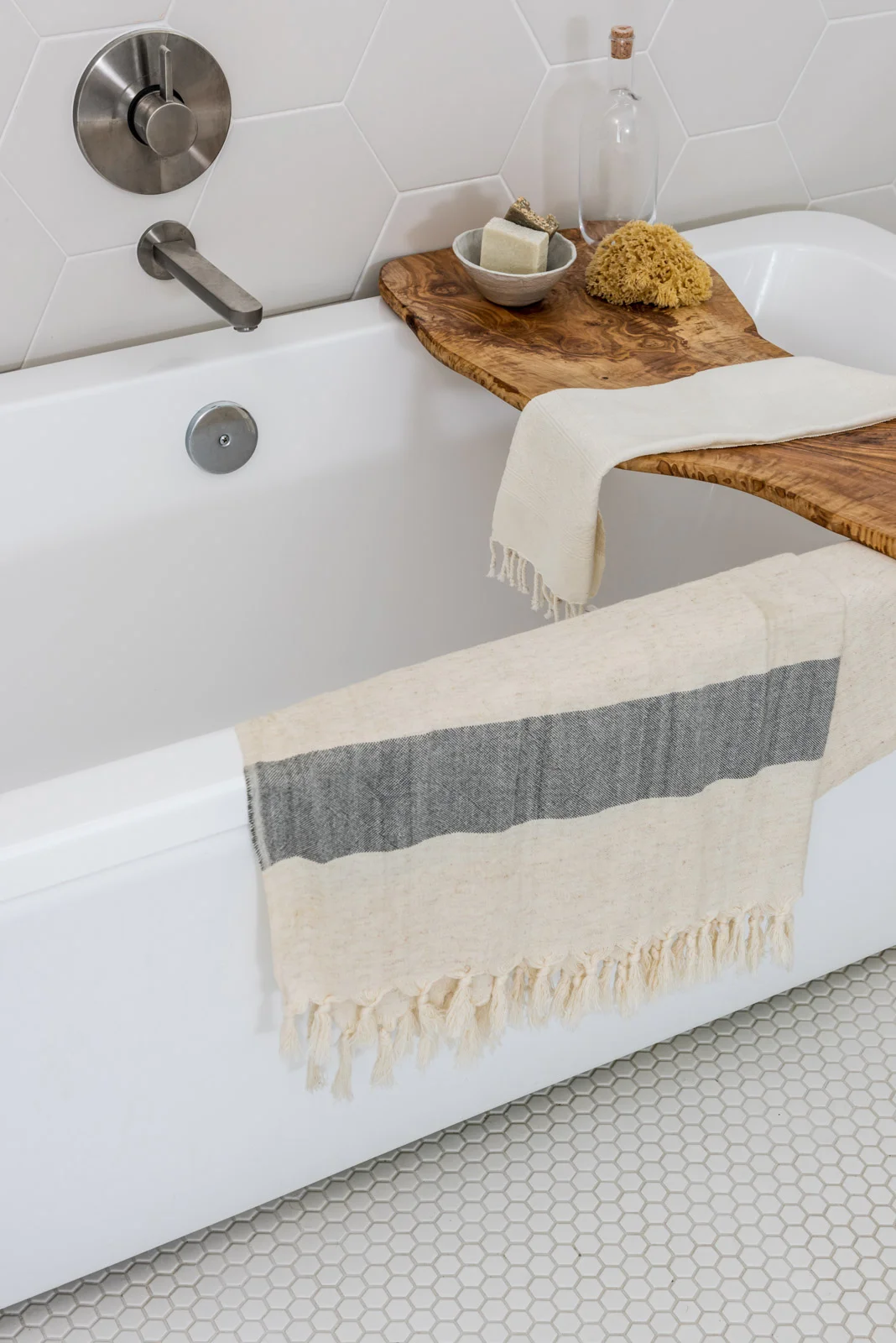 Modern bathtub with towel and toiletries