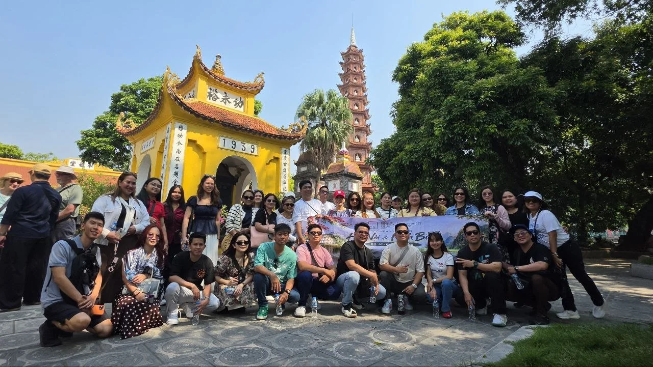 The ExcellerCSI team at their 2026 company retreat at Trấn Quốc Pagoda in Hanoi, Vietnam
