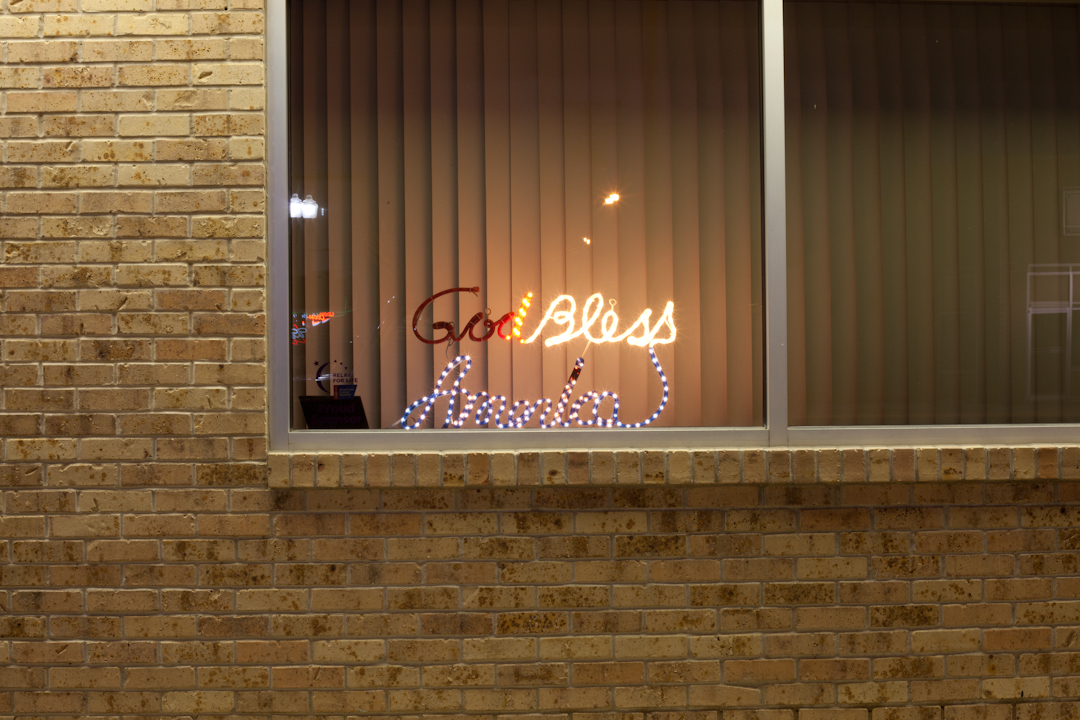 A sign celebrating the 4th of July in the window of an insurance agency in O'Neill, Nebraska. July 2013