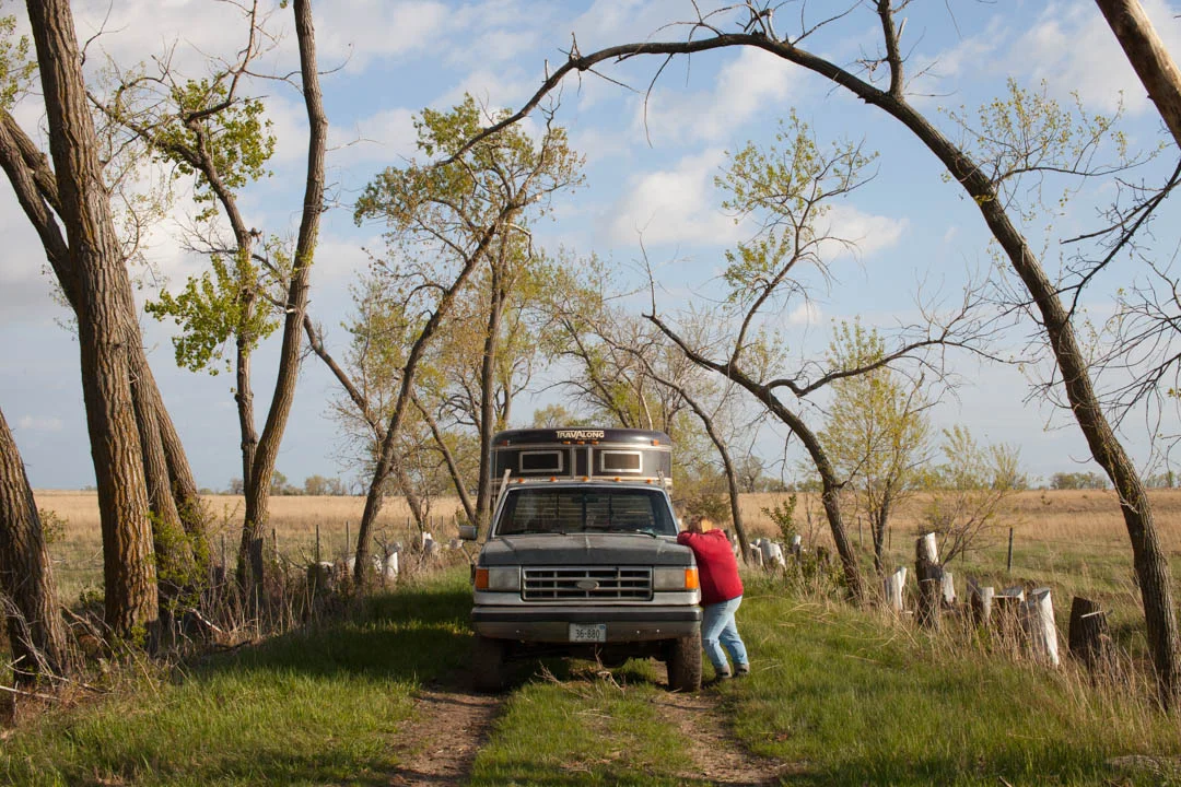 Bonny Kilmurry waits by the pick-up as Richard and Michael Kilmurry pair off cows and calves after the family brought their cattle to pasture. The pipeline is propose to cross within a mile of this location. May 2014