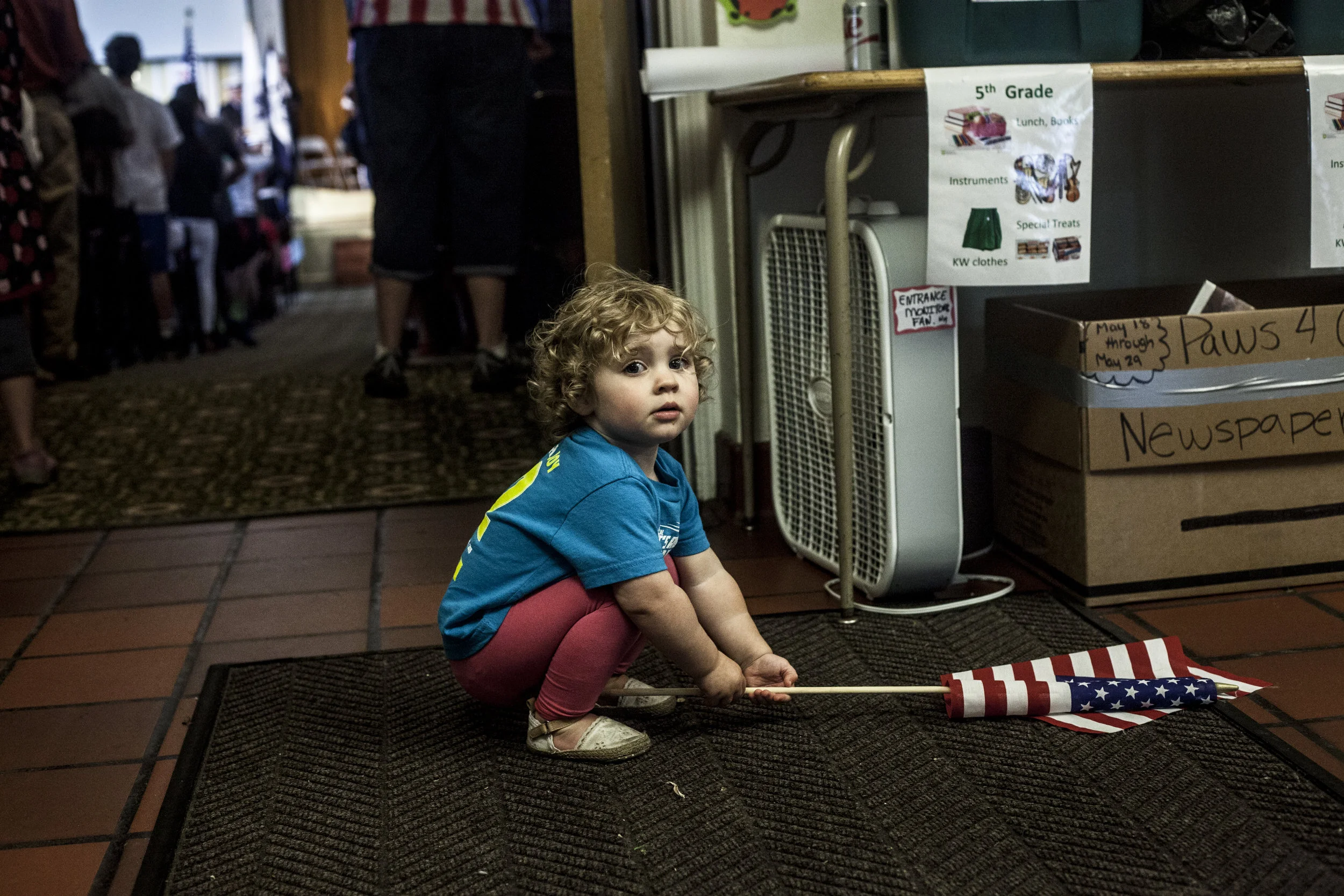 One and a half year old Frankie Shenton plays with an american flag during the 88th Memorial Day Observance.jpg
