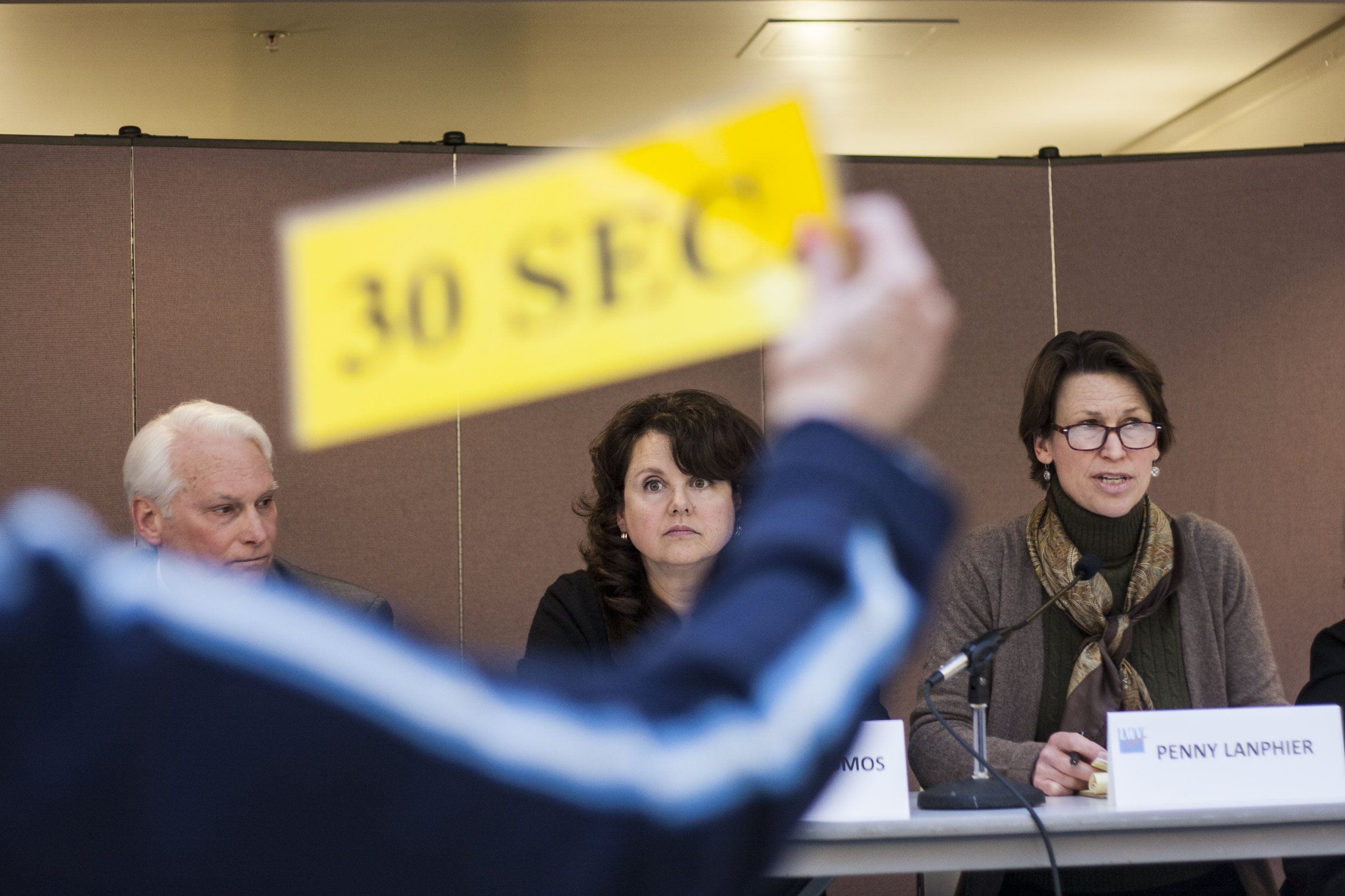 Trustee canidate Penny Lanphier gets the 30 sec que during her answer on Sundat at the Trustee Candidate Forum.jpg