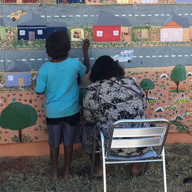 During the last week I've been helping facilitate a huge mural on the front of the Tapatjatjaka Art Centre in Titjikala. The mural depicts the small and remote Northern Territory community and elements of the surrounding landscape. It has been painte
