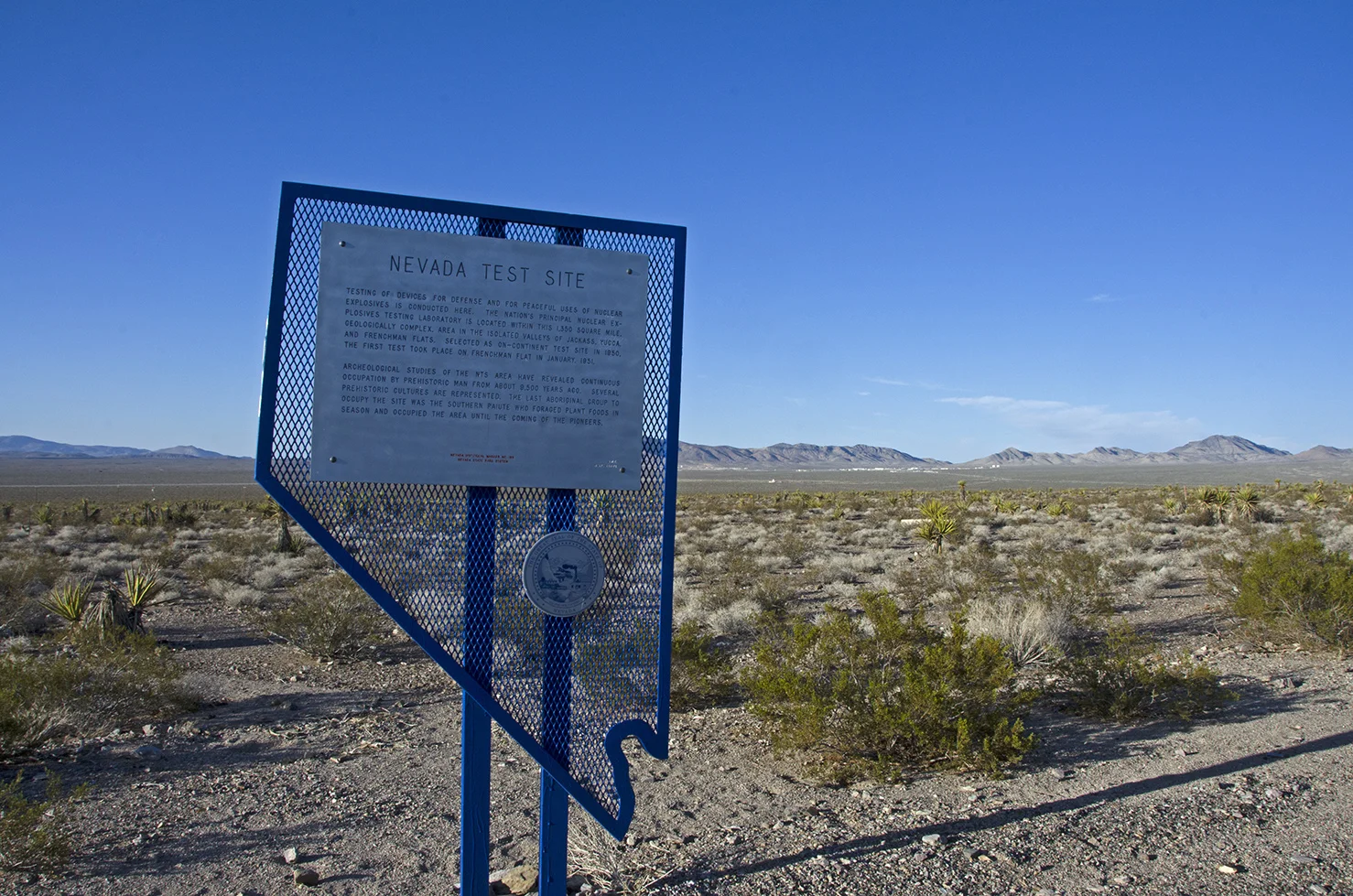 The historic marker at the side of the road.