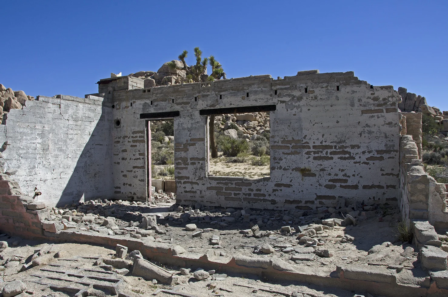 Note the portion of the wall laying flat on the ground.