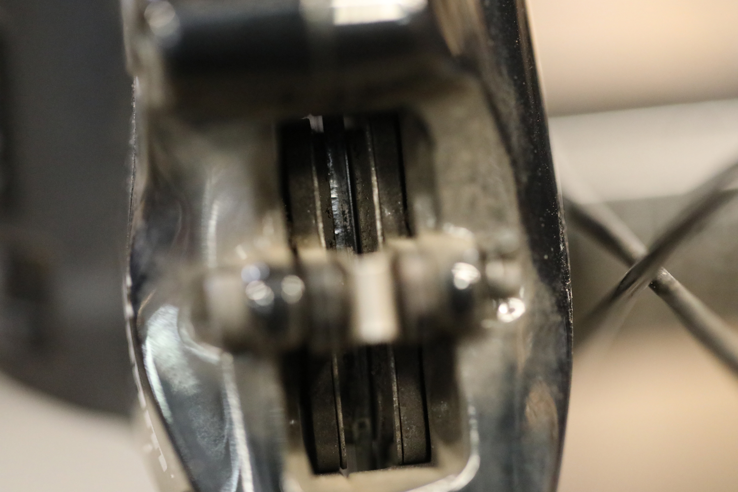 Ideally, the wear on your brake pads should be equal. Notice how, in this case, the left side is more worn than the right. This may indicate an alignment issue.