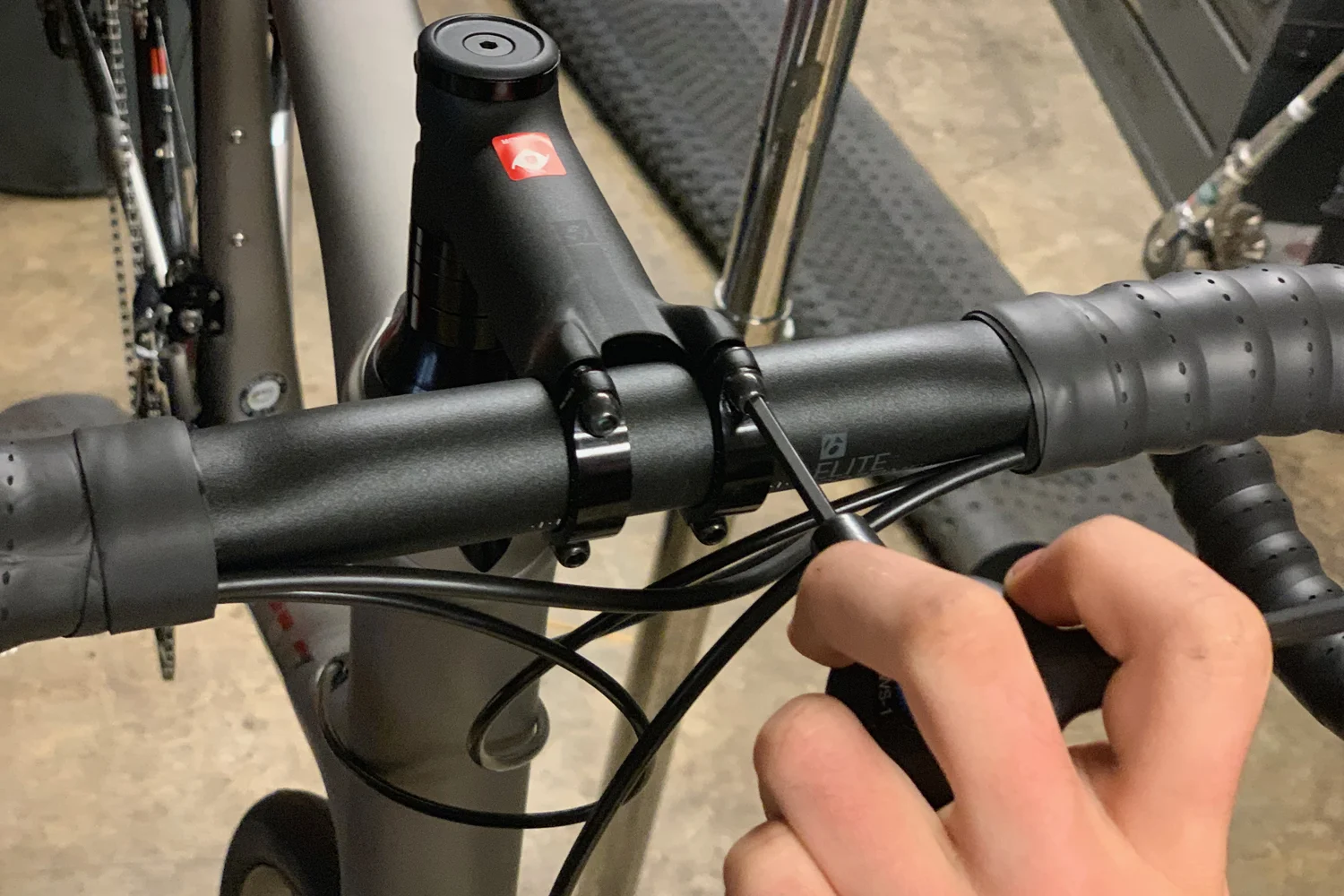 Retightening the stem clamp bolts with a Park Tool 3-way hex wrench.