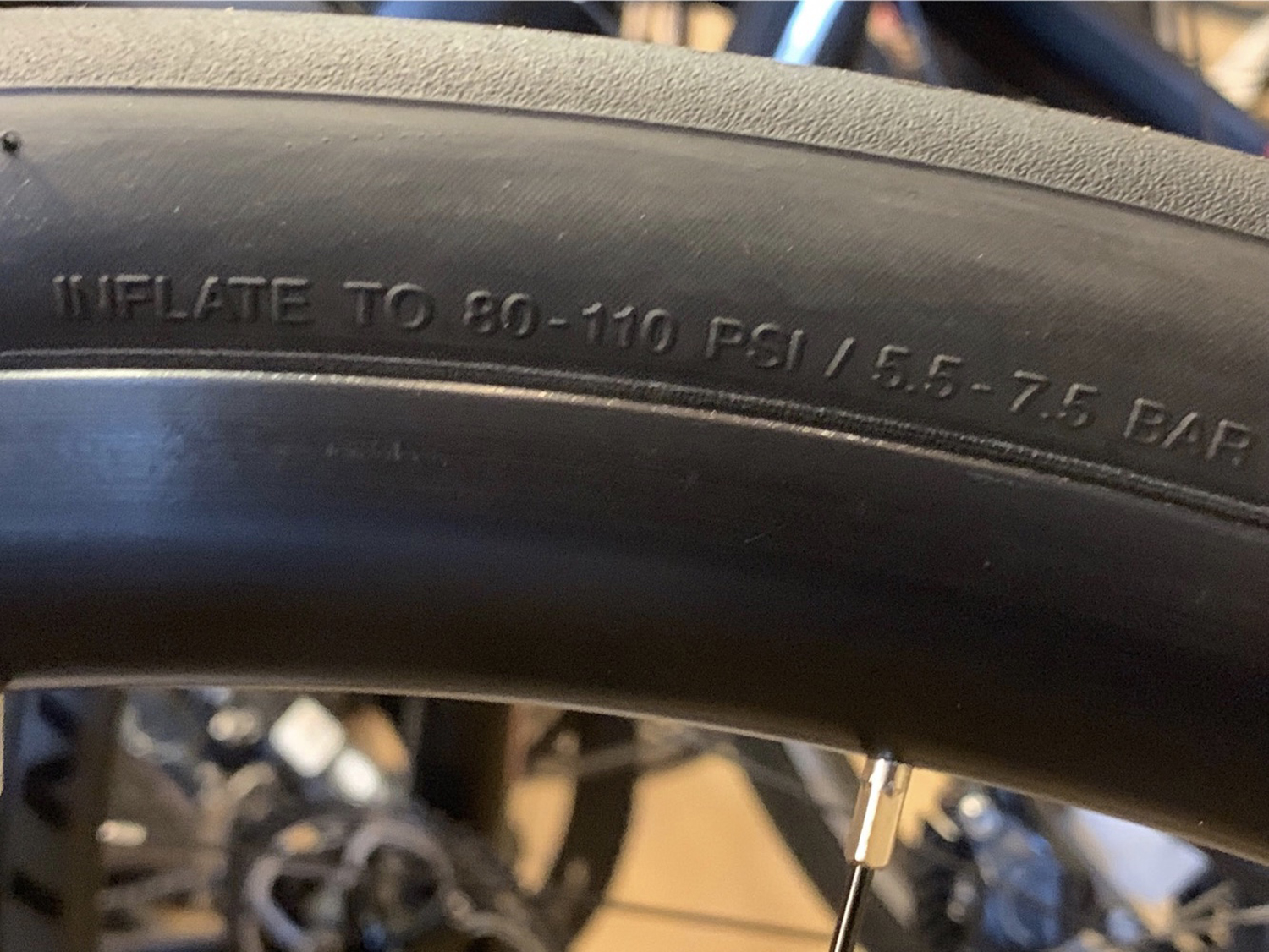 For this road tire, the acceptable pressure range is 80-110 psi. It’s helpful to have a pump with a dial at home.