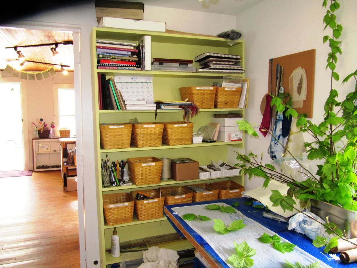 The newly re-painted and organized work room! It took me almost three weeks to replace the previous oatmeal and jaundice color palette with three coats of "Atrium White", "New Avocado", and "Autumn Purple."