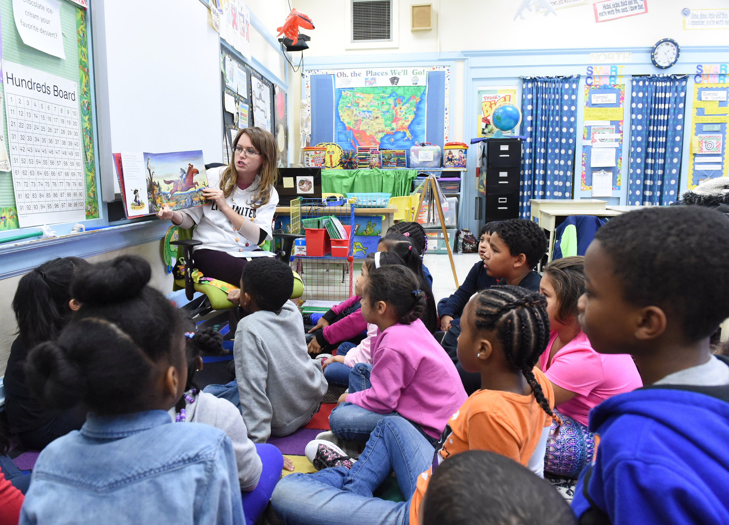  10/19/2015 - Poughkeepsie, NY - Rachel Johnson, vice president of resource development at United Way of the Dutchess-Orange region, reads "The Highway Rat" to second-graders at Clinton Elementary School in the City of Poughkeepsie. 