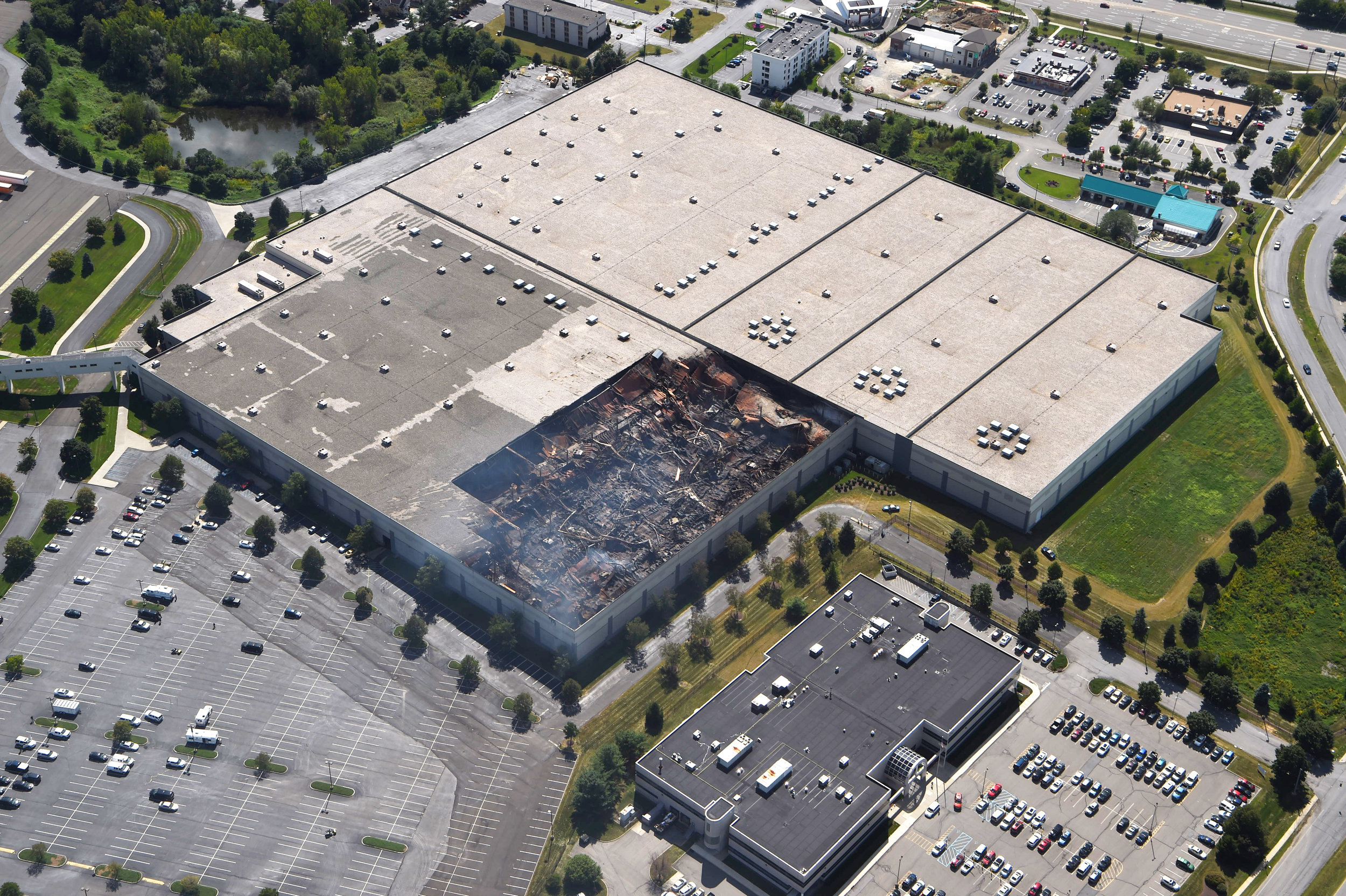  8/30/2016 - Fishkill, NY - This aerial shot of the Gap Inc. distribution center in Fishkill shows the damage left from a fire in one of the facility's buildings late Monday night into Tuesday morning. 