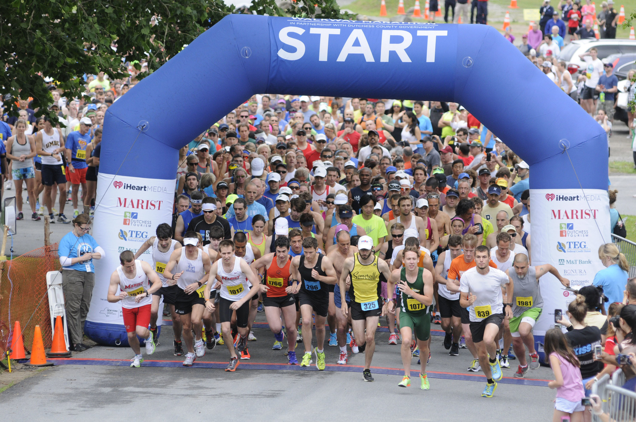  6/13/2015 - Poughkeepsie, NY - Runners begin the Walkway Marathon on the eastern bank of the Hudson River in Poughkeepsie, near Marist College's Boathouse. 