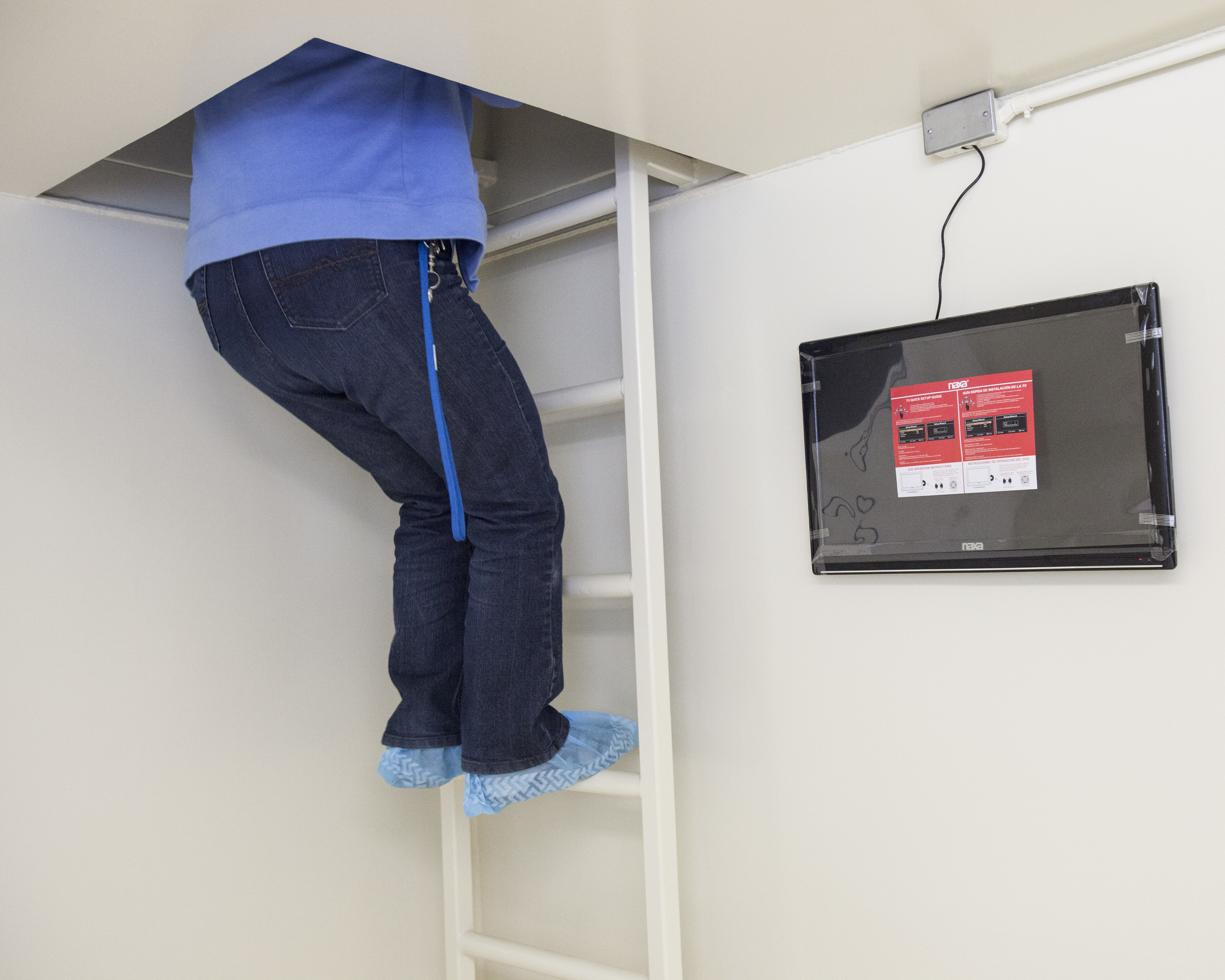 A customer explores the inside of a nearly-completed underground bunker.