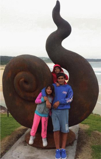 Figure 8. The kids posing for a photo with a big snail at Merimbula's Main Beach. Such a great opportunity for all of us to bond even closer together.