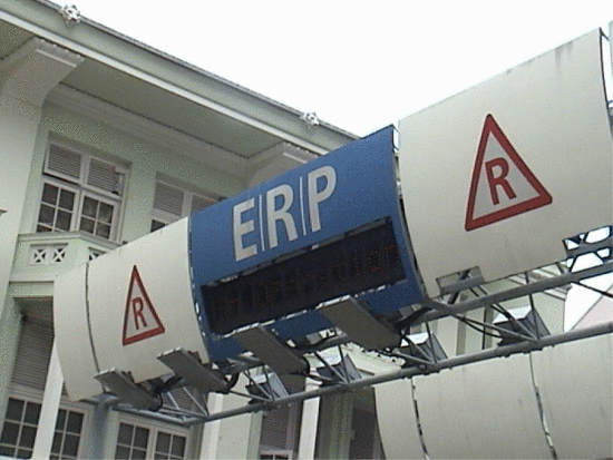 Fig. 5. Singapore's Electronic Road Pricing (ERP) system. The ERP uses a dedicated short-range radio communication system to deduct ERP charges from CashCards. These are inserted in the in-vehicle units of vehicles before each journey. Each time vehicles pass through a gantry when the system is in operation, the ERP charges are automatically deducted. Courtesy of Katina Michael 2003.