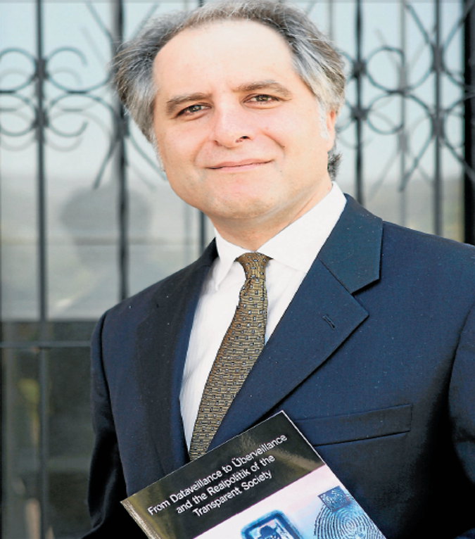 Dr MG Michael with his new book From Dataveillance to Uberveillance and the Realpolitik of the Transparent Society. Picture: ANDY ZAKELI