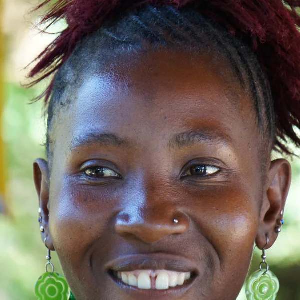 BENTA KAMININGA Member Extraordinaire Benta is changing the way we view women in poverty. She is full of zest and has an unmatched passion for life, although she hates doing laundry. She speaks four languages, and feels that this is a key to her success in business; she is determined to speak well and get to know her customers better. Benta has used her loans to purchase large quantities of fish and dried foods to sell at the market. She is a gritty and savvy business woman, driven by the desire to provide for children and educate them so they have a positive future.