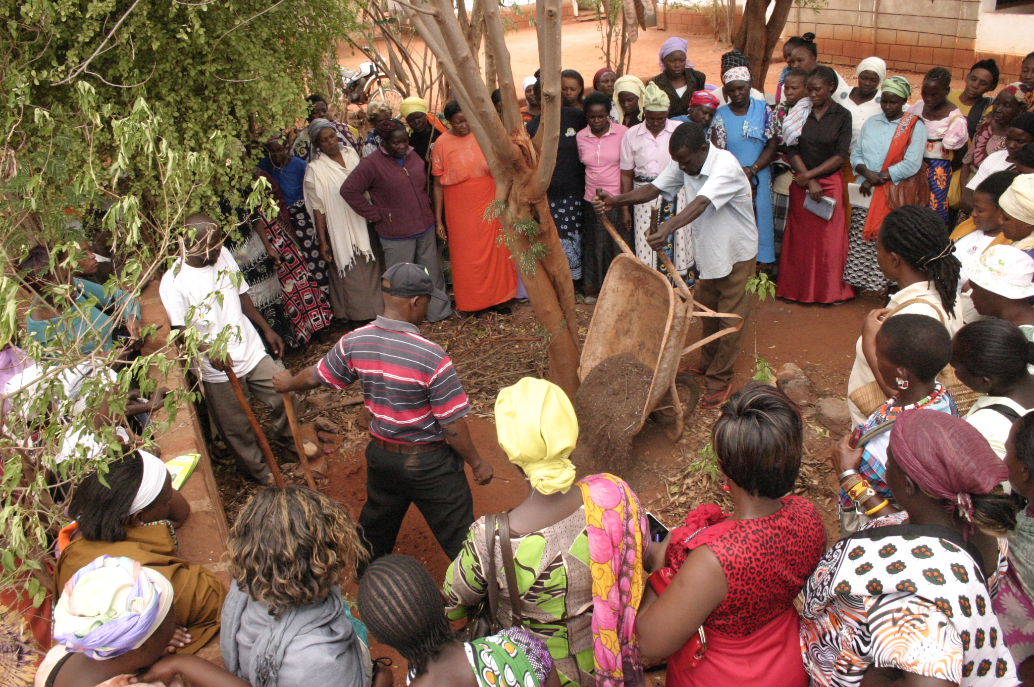 70 women representing 30 different savings groups participate in a 2-day training on agriculture, rain water harvesting, micro-gardening, and income generating activities.