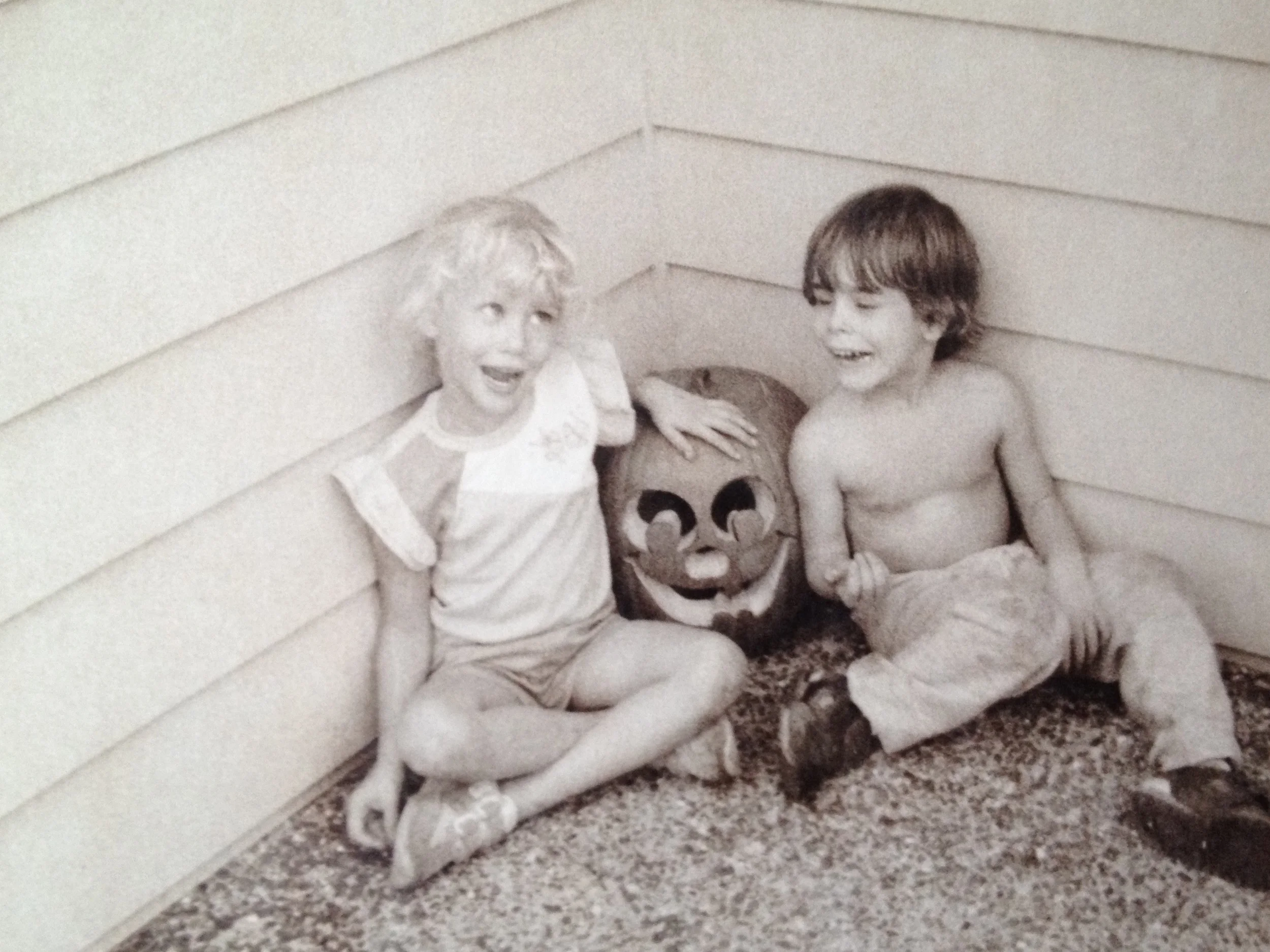 My sister and my cousin posing with their Jack-O-Lantern. 