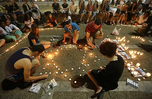 Teens gather in Tel Aviv's Rabin Square to mourn the loss of their teenage friends.