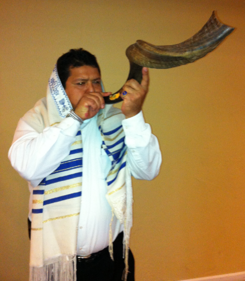 Ariel blows the shofar