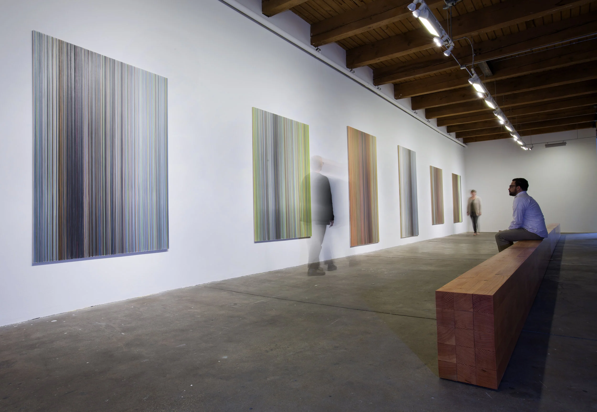 installation view of walking as I stand six drawings and axis 10.5 inches by 17.5 inches by 50ft Douglas fir