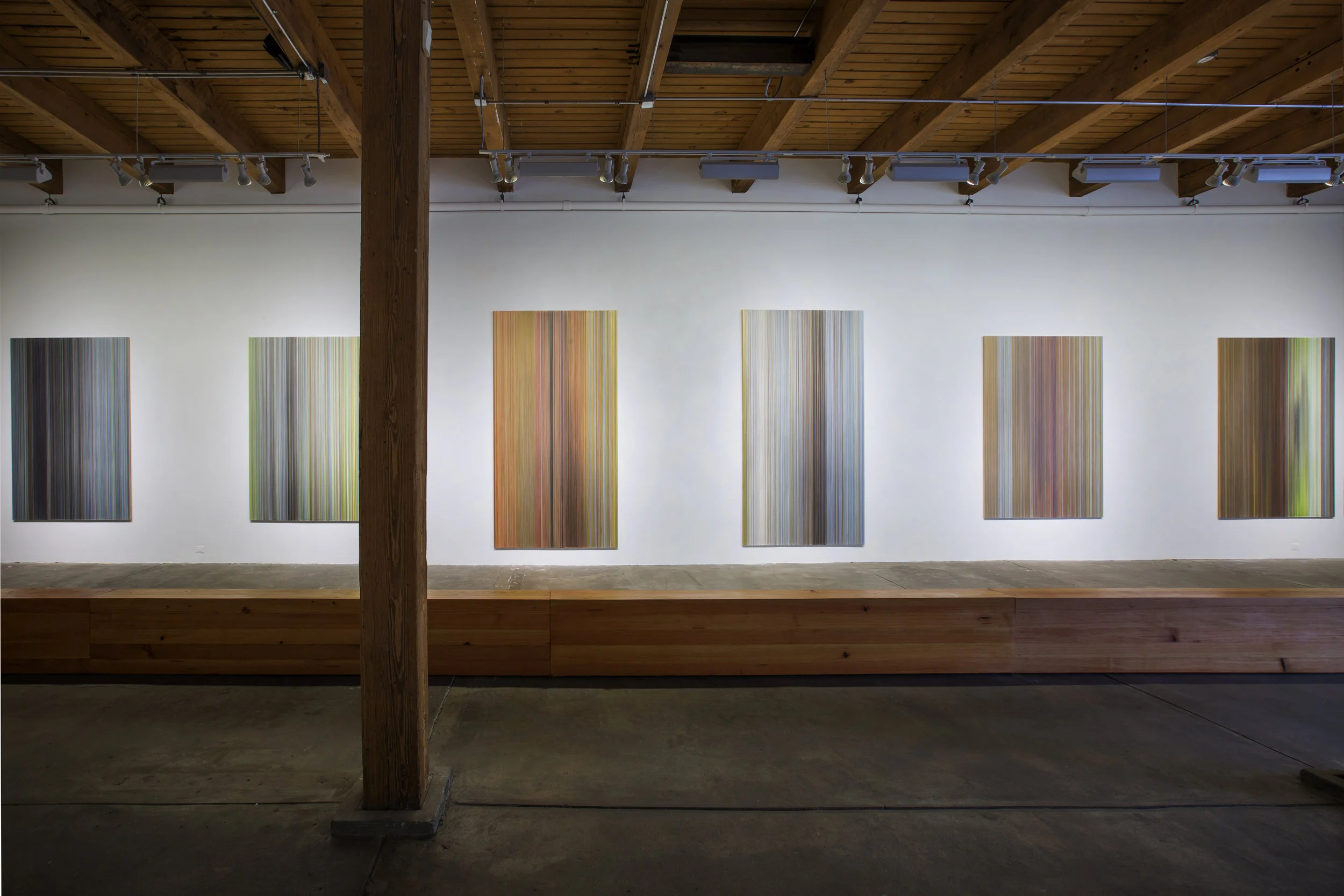 installation view of walking as I stand six drawings and axis 10.5 inches by 17.5 inches by 50ft Douglas fir