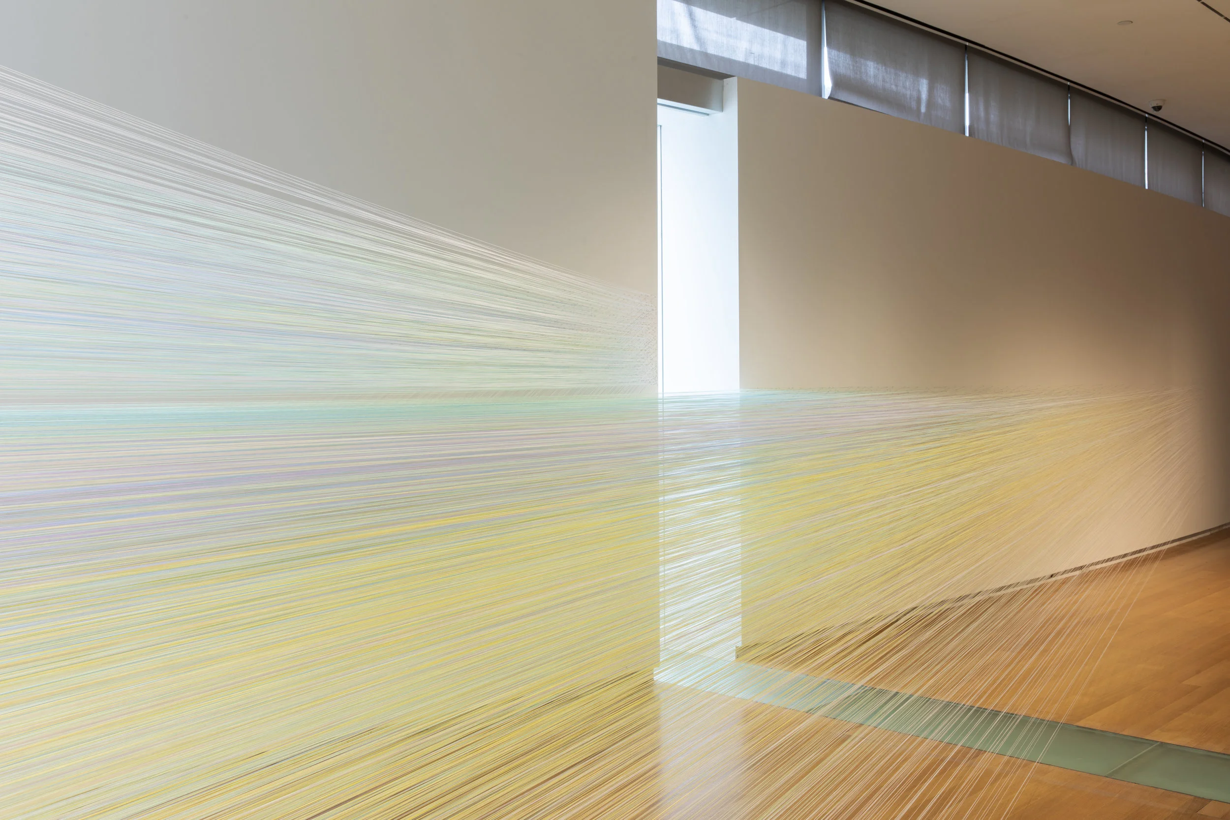 the eye’s level 2018 cotton thread and staples 5 by 56 by 18 feet photograph by Jenna Bascom, courtesy the Museum of Arts and Design