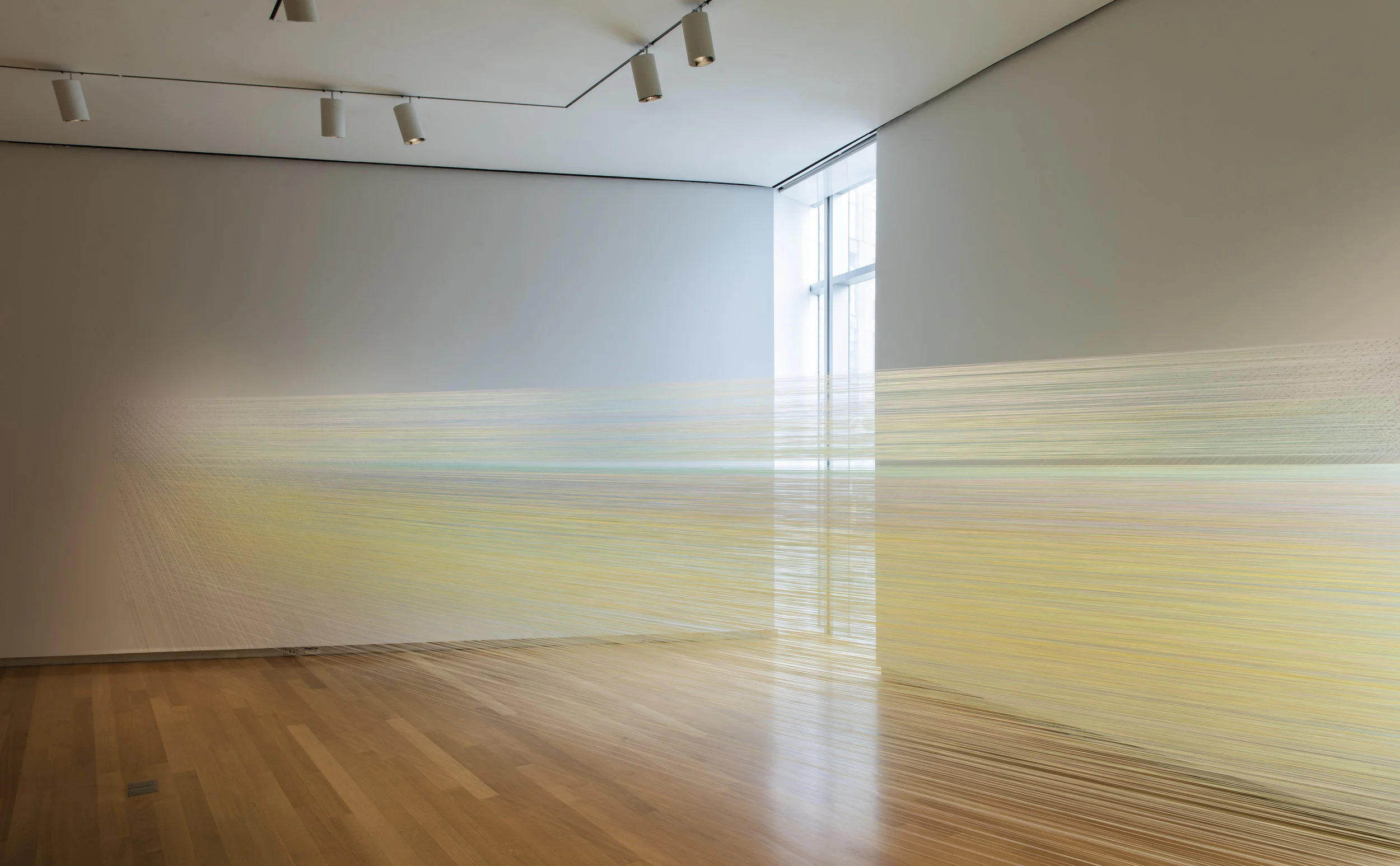 the eye’s level 2018 cotton thread and staples 5 by 56 by 18 feet photograph by Jenna Bascom, courtesy the Museum of Arts and Design