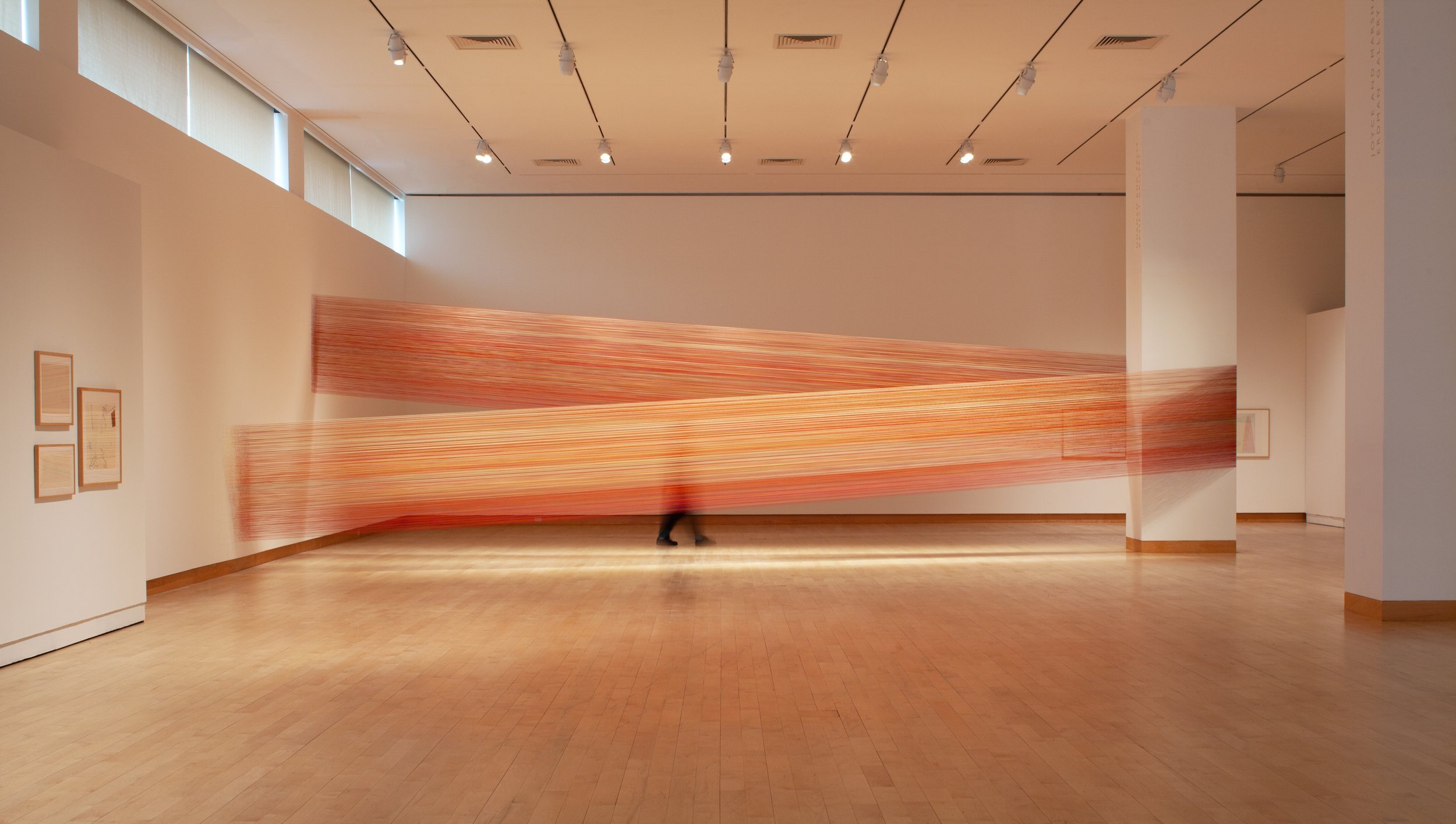    impossible red   2023 cotton thread and staples 10 x 33 x 16 feet exhibited in   imaginary i,   curated by Christina Brungardt at Madison Museum of Contemporary Art, Madison, WI 