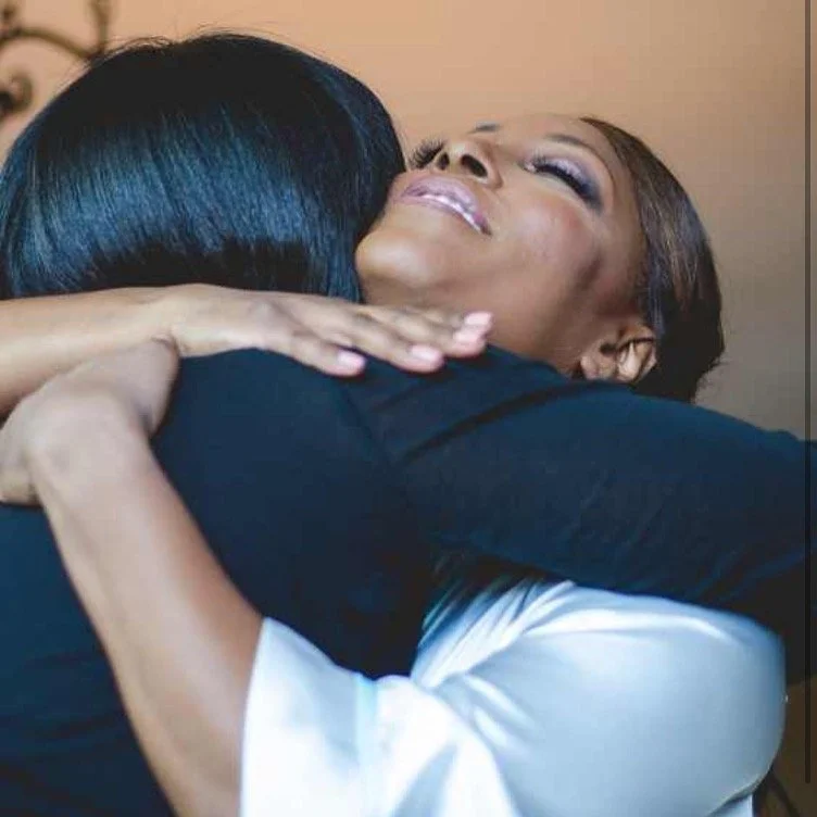Happy bride hugging her makeup artist Keena Queen after her bridal makeup
