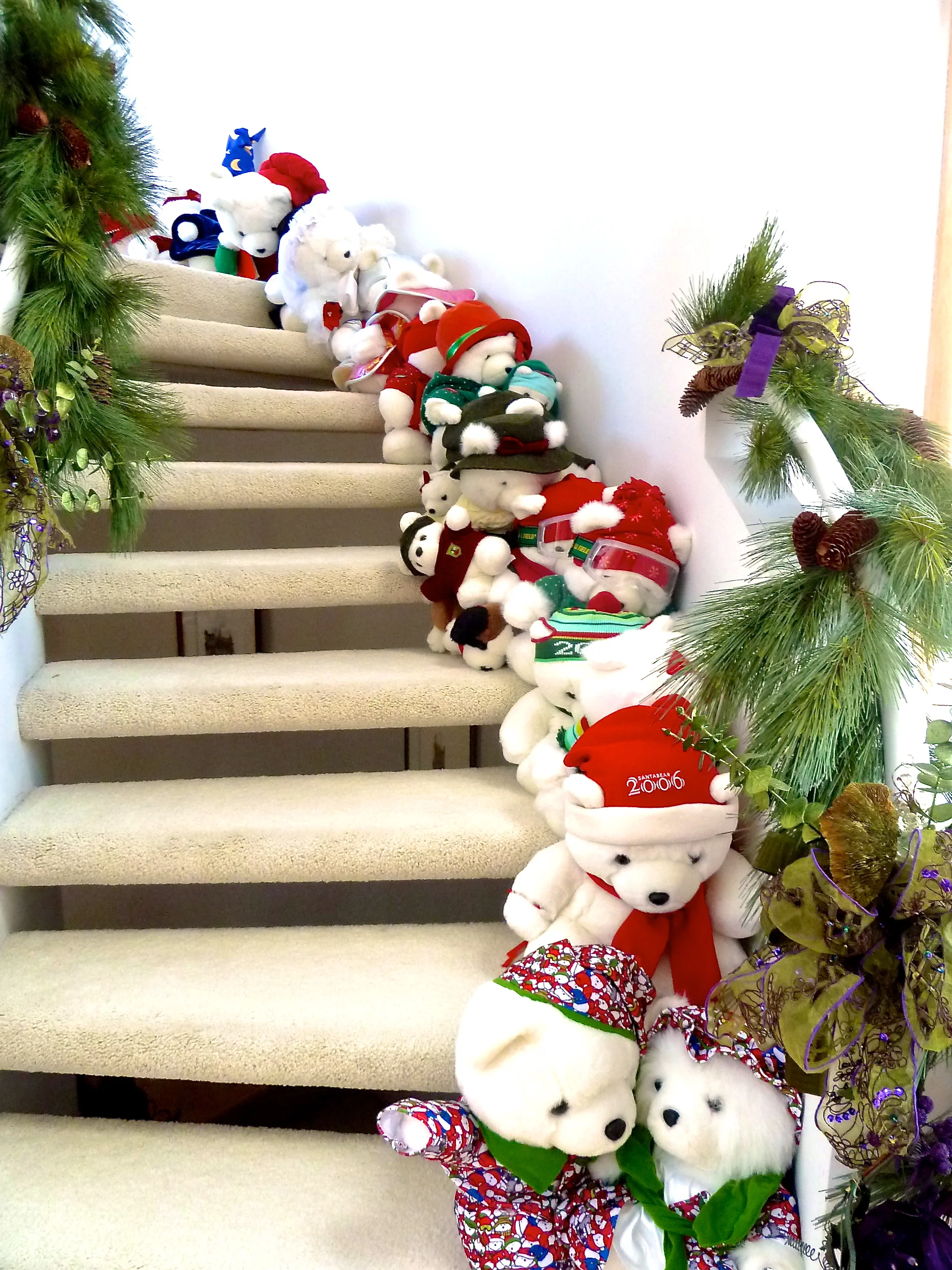 Banisters, Boughs, Bows and Bears oh my! This Santa Bear collection makes kids of all ages smile.