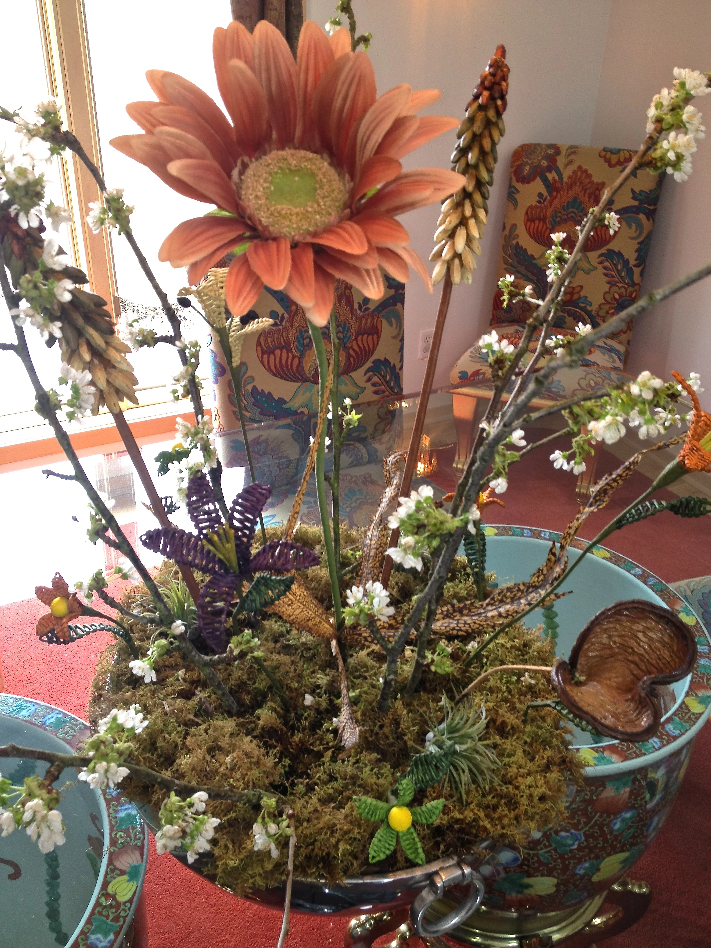 Cindi Sutter provides an example of fresh flowers dancing with artificial! Some are made from paper, some fresh, some silk; you decide which are fresh and let us know. 