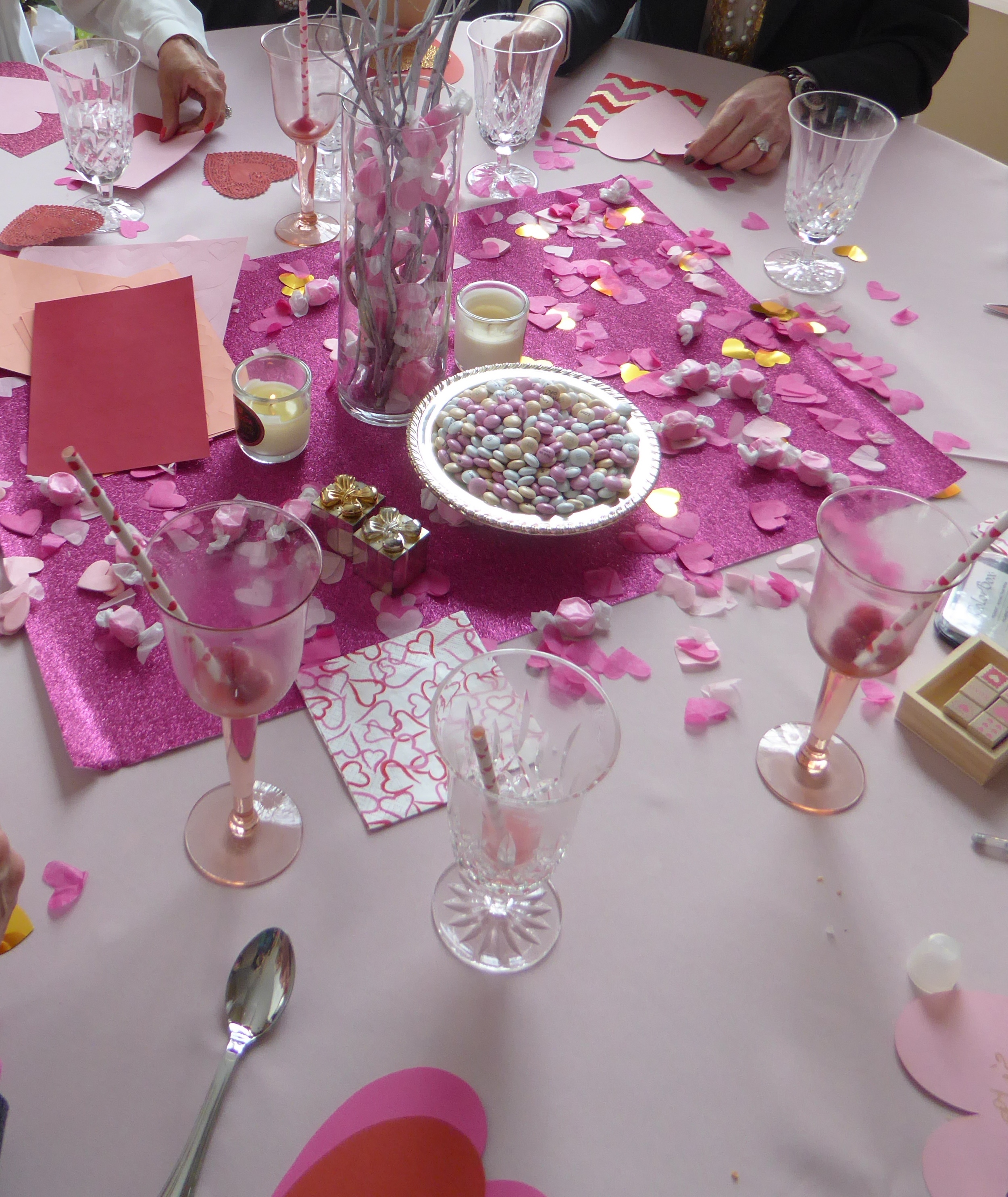 Pink taffy inside a clear vase with white birch