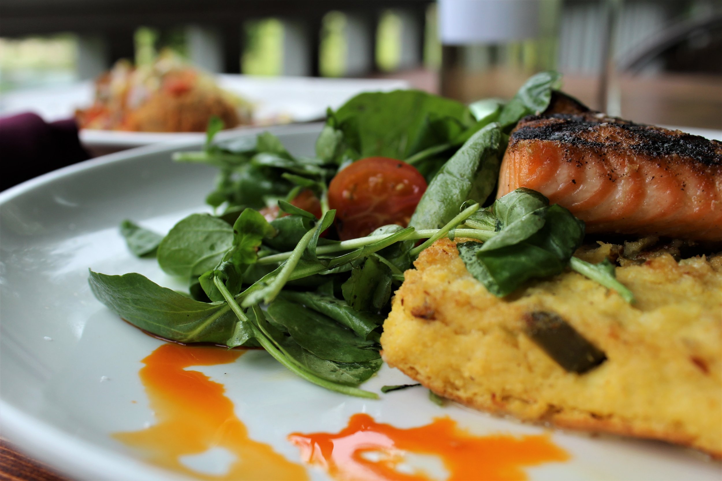 "Our Grilled Salmon with Hard Cider Butter Sauce served over roasted corn, crispy bacon and sweet potato succotash pairs eloquently with a glass of oak-aged Chardonnay."