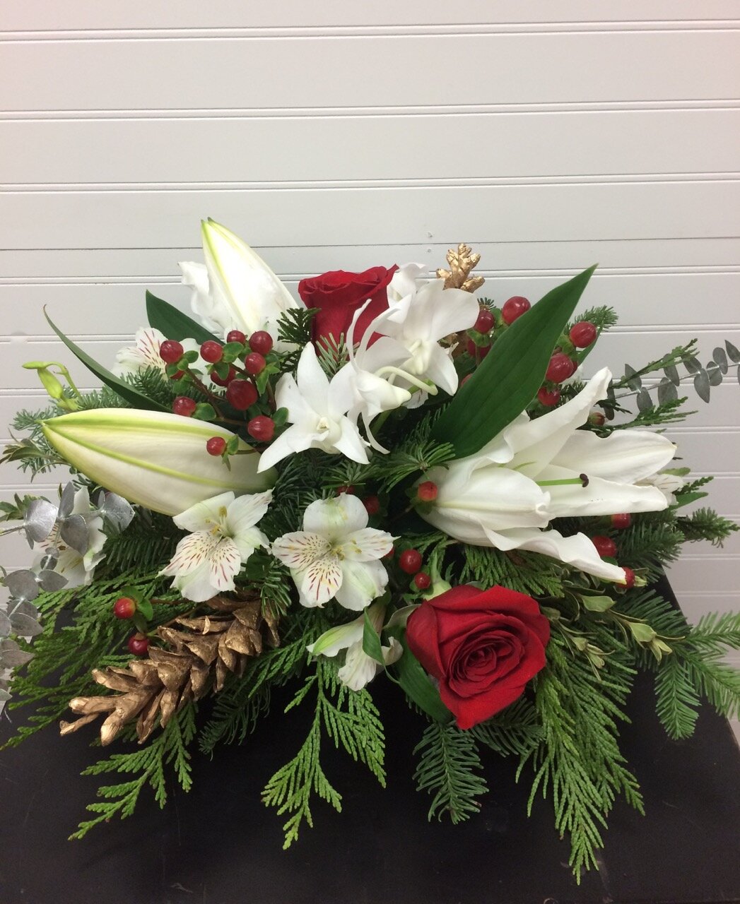 Christmas Lilies Orchids Roses and Berries