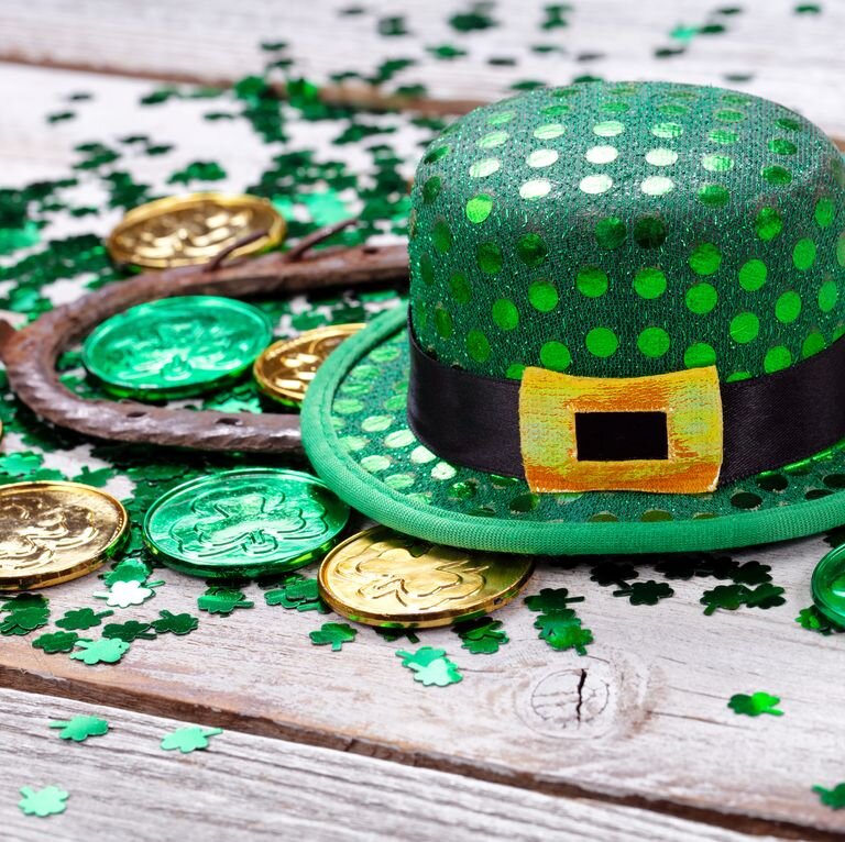 close-up-of-coins-with-horseshoe-and-hat-on-wooden-royalty-free-image-1611334814..jpeg