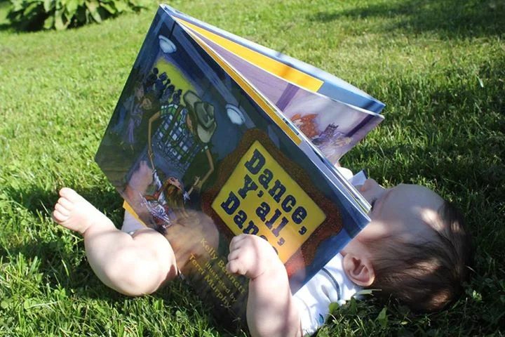 Katie and Liam's baby Ross--a discerning reader, Yee haw!