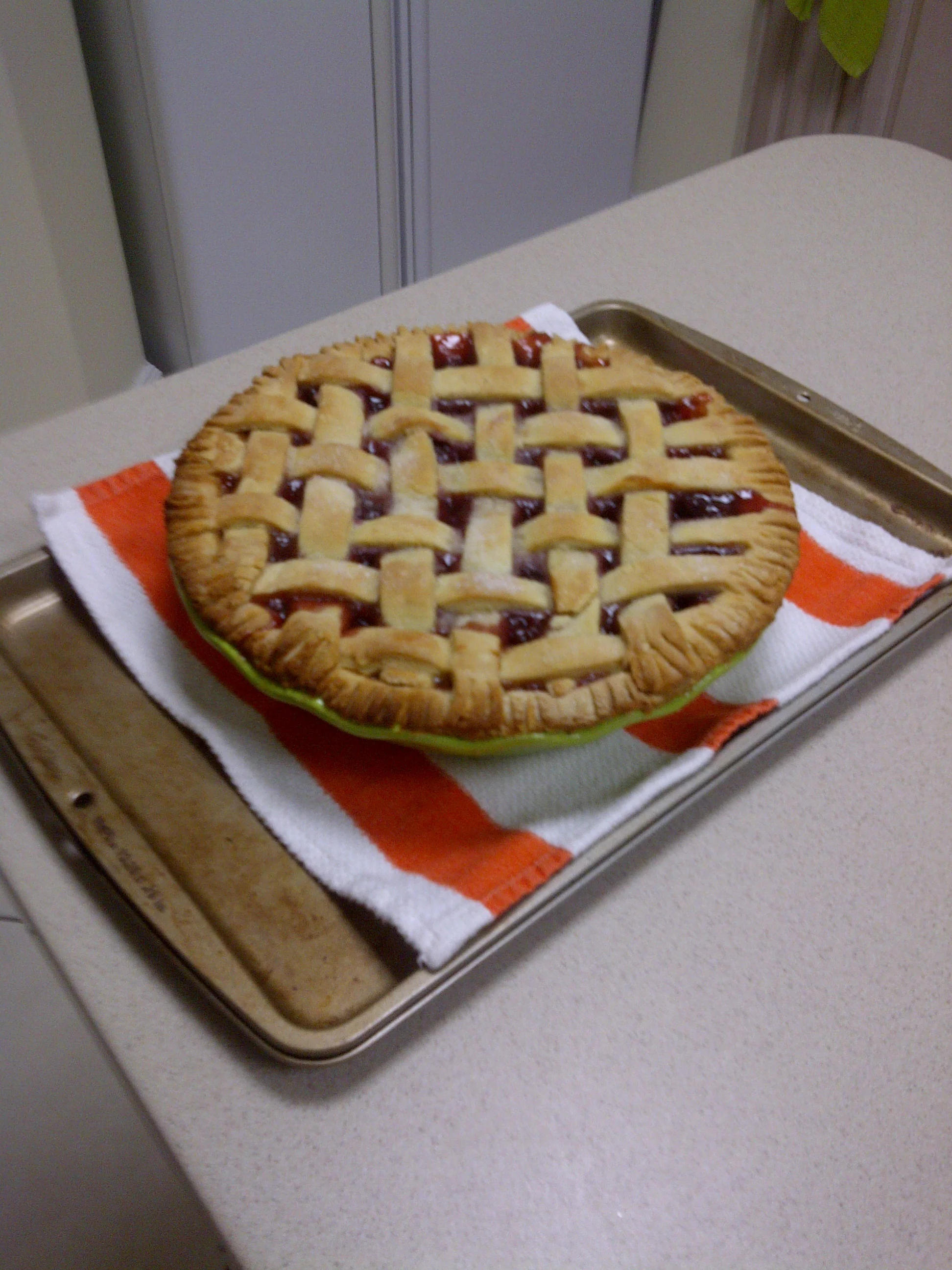 Who'd a thunk a chilled bottle of rum punch serving as rolling pin could result in such a fine lattice work top for a cherry pie? Adele, my mom-in-law gifted me with the bottle her grandmother used as a rolling pin. 