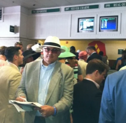 Racing Form in hand, Curtis lines up at the Betting Window