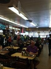 Sat at Meg Ryan's infamous " Sleepless in Seattle " table at Katz's Deli (with the bossiest, grouchiest staff in the world!)