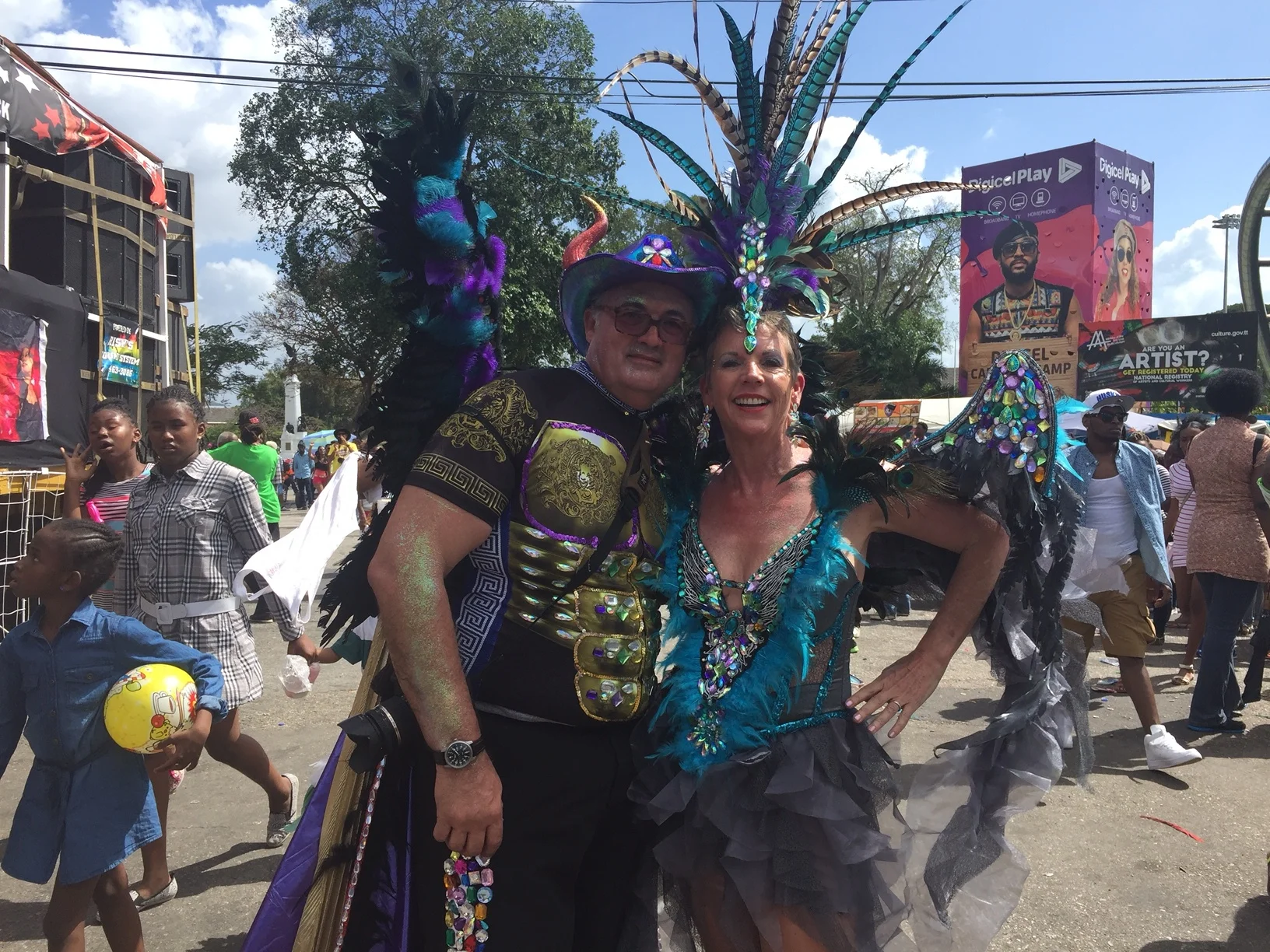 Yes, Curtis and I (with help from friends) glued all those beads, feathers and bling onto our Trini Devil & Angel costumes.