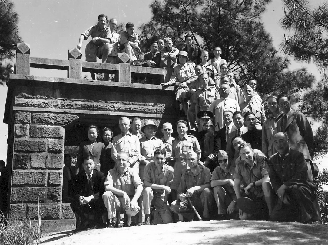 Allied officers and civilians in Chungking, including Max (centre) and Admiral Yang (on Max's right)