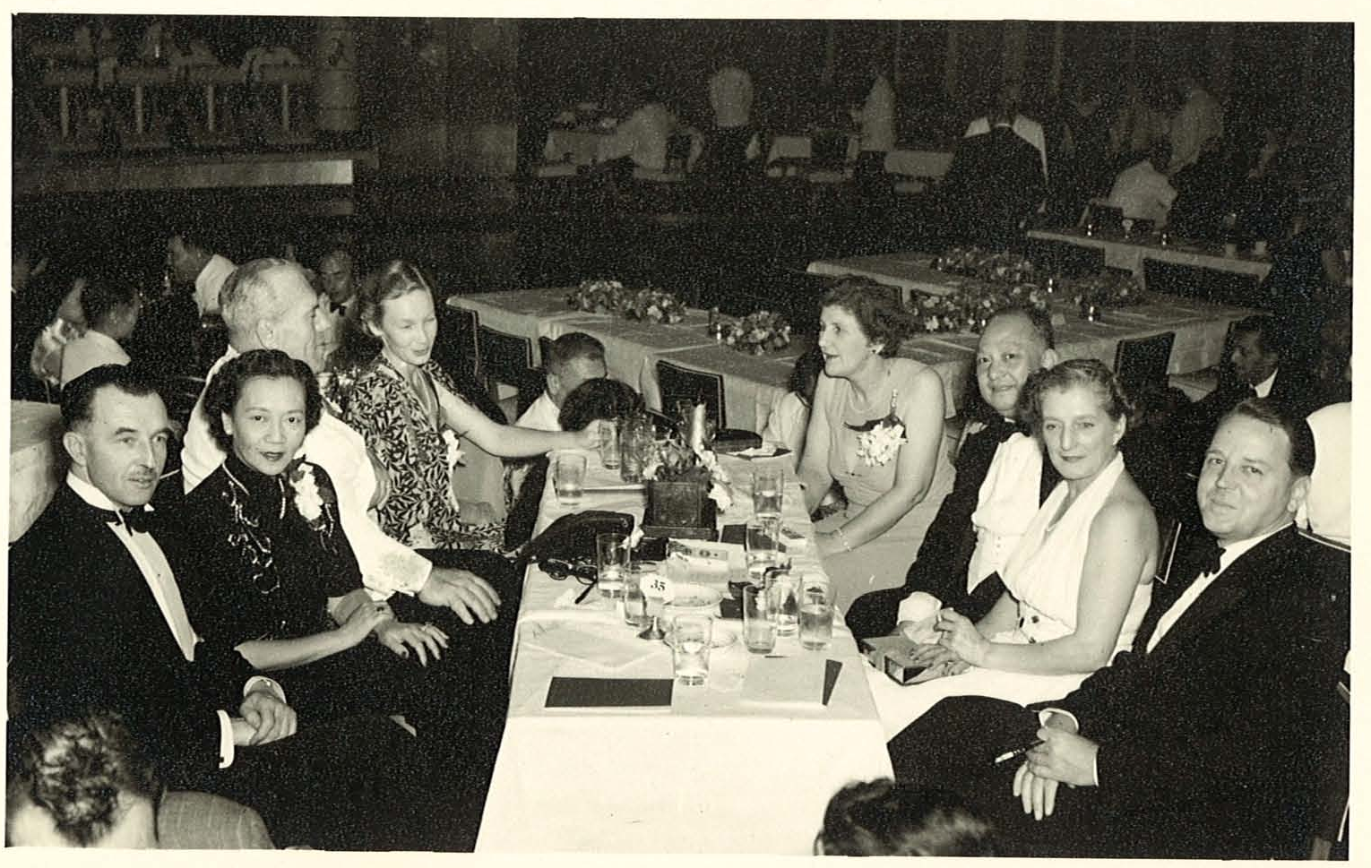 Max (front right) and Audrey (back left) have dinner with friends at Luna Park, 1950