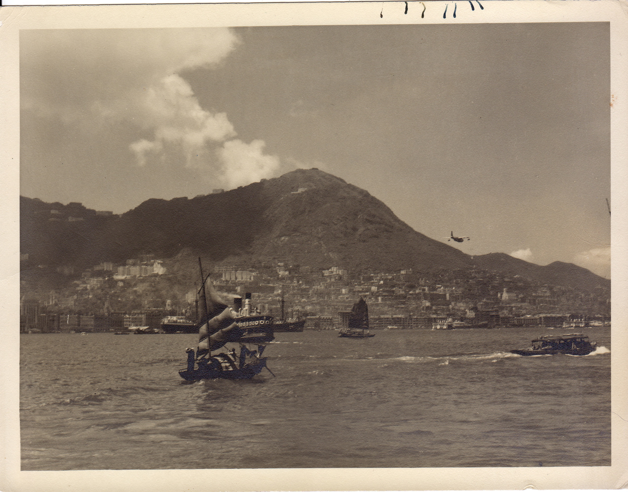 Planes, junks and ferries traffic Hong Kong harbour, 1950